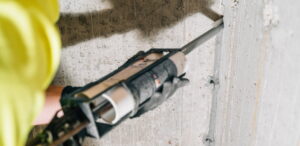 Zander employee injecting crack solution