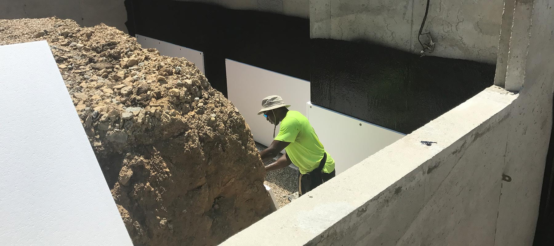 Zander employee working on an exterior waterproofing project