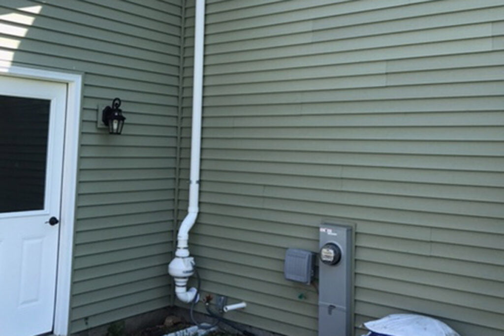 radon pump on side of house
