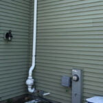 radon pump on side of house