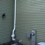radon pump on side of house