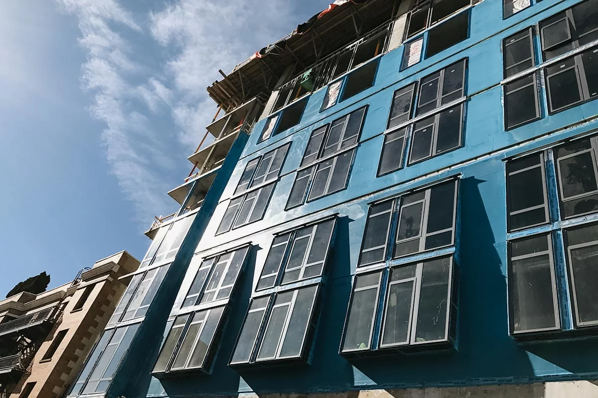 waterproof layers applied to the side of an office building