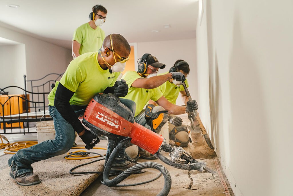 4 Zander employees digging out a drain tile site