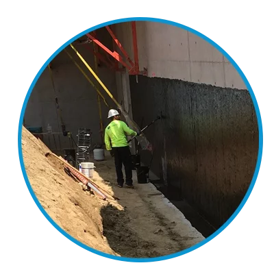 Zander employee applying sheet waterproofing