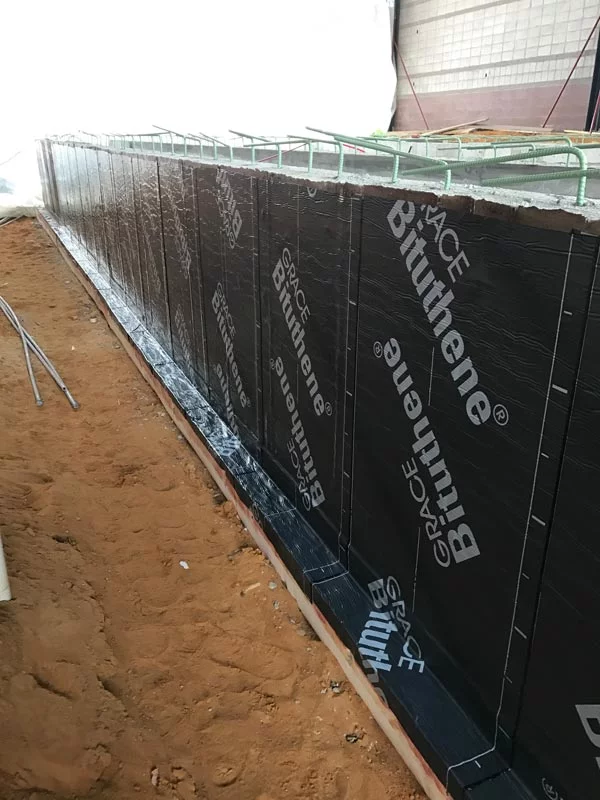 foundation waterproofing on the side of a building