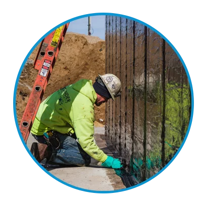 Zander employee applying sheet waterproofing