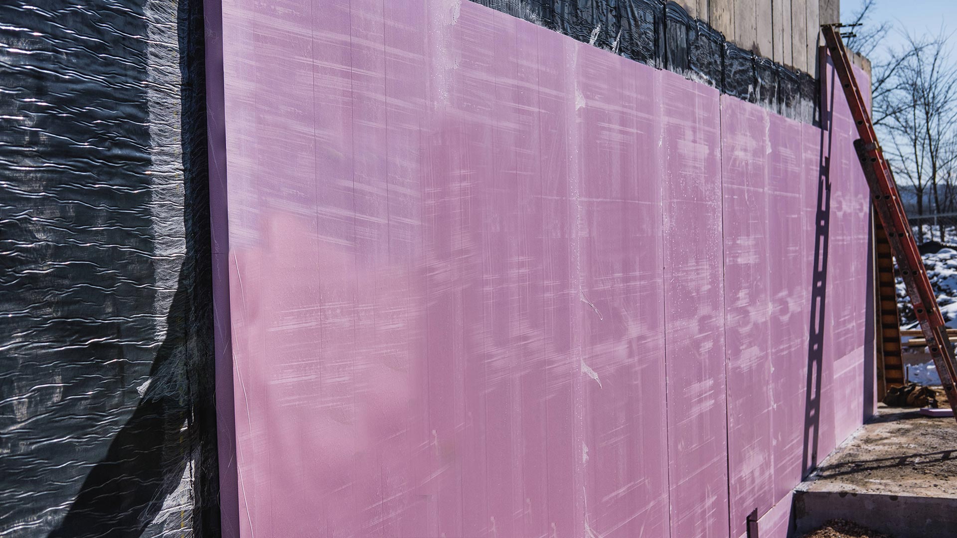 a wall with layers of waterproofing on it