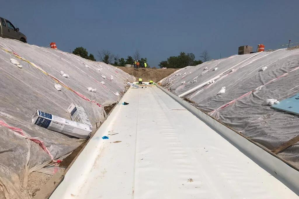 waterproof membranes being applied at a site