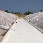 waterproof membranes being applied at a site