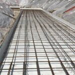 waterproof membranes being applied at a site