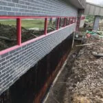 a trench along the wall of a building