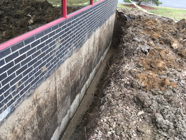 a trench dug out around a wall