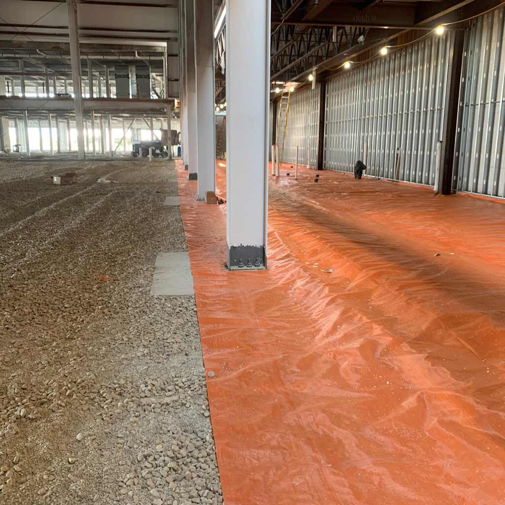 a job site with a large liner along the floor