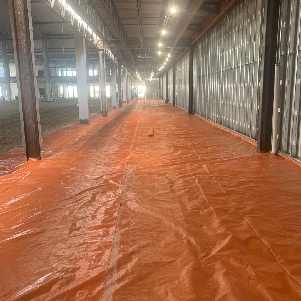 a job site with a large liner along the floor