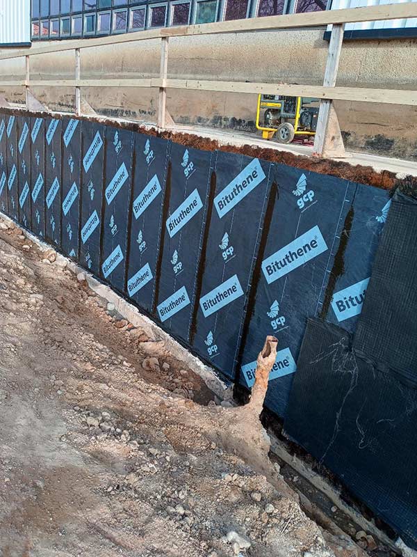 Foundation waterproofing on a jobsite