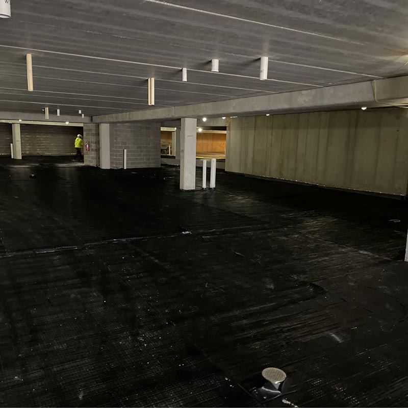 Vapor barrier on lower level of a large concrete structure