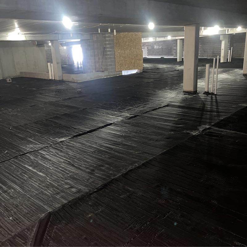 Vapor barrier on lower level of a large concrete structure